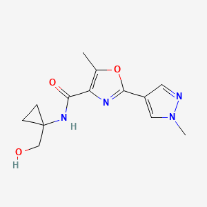 molecular formula C13H16N4O3 B6761626 N-[1-(hydroxymethyl)cyclopropyl]-5-methyl-2-(1-methylpyrazol-4-yl)-1,3-oxazole-4-carboxamide 