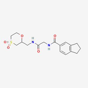 molecular formula C17H22N2O5S B6761830 N-[2-[(4,4-dioxo-1,4-oxathian-2-yl)methylamino]-2-oxoethyl]-2,3-dihydro-1H-indene-5-carboxamide 