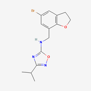 molecular formula C14H16BrN3O2 B6766978 N-[(5-bromo-2,3-dihydro-1-benzofuran-7-yl)methyl]-3-propan-2-yl-1,2,4-oxadiazol-5-amine 