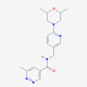molecular formula C18H23N5O2 B6771842 N-[[6-(2,6-dimethylmorpholin-4-yl)pyridin-3-yl]methyl]-6-methylpyridazine-4-carboxamide 