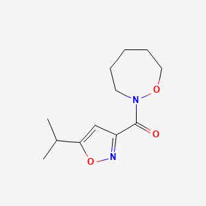molecular formula C12H18N2O3 B6772360 Oxazepan-2-yl-(5-propan-2-yl-1,2-oxazol-3-yl)methanone 
