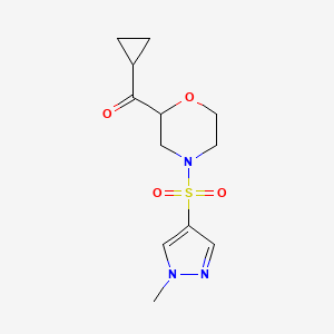 molecular formula C12H17N3O4S B6783101 Cyclopropyl-[4-(1-methylpyrazol-4-yl)sulfonylmorpholin-2-yl]methanone 
