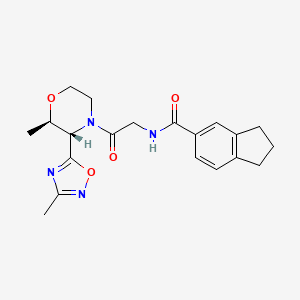 molecular formula C20H24N4O4 B6784910 N-[2-[(2R,3S)-2-methyl-3-(3-methyl-1,2,4-oxadiazol-5-yl)morpholin-4-yl]-2-oxoethyl]-2,3-dihydro-1H-indene-5-carboxamide 