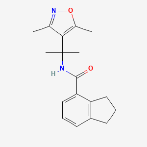 molecular formula C18H22N2O2 B6786704 N-[2-(3,5-dimethyl-1,2-oxazol-4-yl)propan-2-yl]-2,3-dihydro-1H-indene-4-carboxamide 