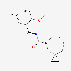 molecular formula C18H26N2O3 B6800716 N-[(1R)-1-(2-methoxy-5-methylphenyl)ethyl]-5-oxa-8-azaspiro[2.6]nonane-8-carboxamide 