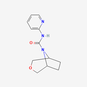 molecular formula C12H15N3O2 B6800955 N-pyridin-2-yl-3-oxa-8-azabicyclo[3.2.1]octane-8-carboxamide 
