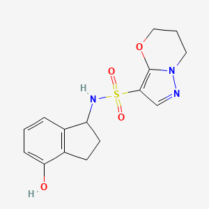 molecular formula C15H17N3O4S B6804158 N-(4-hydroxy-2,3-dihydro-1H-inden-1-yl)-6,7-dihydro-5H-pyrazolo[5,1-b][1,3]oxazine-3-sulfonamide 