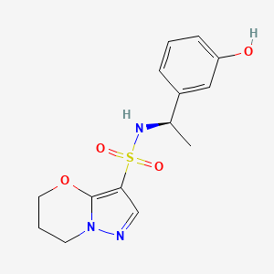 molecular formula C14H17N3O4S B6804247 N-[(1R)-1-(3-hydroxyphenyl)ethyl]-6,7-dihydro-5H-pyrazolo[5,1-b][1,3]oxazine-3-sulfonamide 