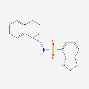 molecular formula C19H19NO3S B6807267 N-(1a,2,3,7b-tetrahydro-1H-cyclopropa[a]naphthalen-1-yl)-2,3-dihydro-1-benzofuran-7-sulfonamide 
