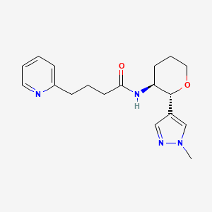 molecular formula C18H24N4O2 B6818400 N-[(2R,3S)-2-(1-methylpyrazol-4-yl)oxan-3-yl]-4-pyridin-2-ylbutanamide 