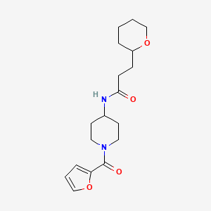 molecular formula C18H26N2O4 B6920953 N-[1-(furan-2-carbonyl)piperidin-4-yl]-3-(oxan-2-yl)propanamide 