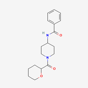 molecular formula C18H24N2O3 B6945377 N-[1-(oxane-2-carbonyl)piperidin-4-yl]benzamide 