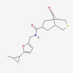 molecular formula C18H23NO3S B6994797 N-[[5-(2-methylcyclopropyl)furan-2-yl]methyl]-9-oxo-3-thiabicyclo[3.3.1]nonane-7-carboxamide 