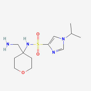 molecular formula C12H22N4O3S B6997472 N-[4-(aminomethyl)oxan-4-yl]-1-propan-2-ylimidazole-4-sulfonamide 