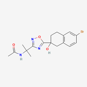 molecular formula C17H20BrN3O3 B6997758 N-[2-[5-(6-bromo-2-hydroxy-3,4-dihydro-1H-naphthalen-2-yl)-1,2,4-oxadiazol-3-yl]propan-2-yl]acetamide 