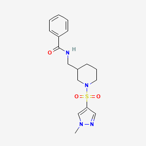 molecular formula C17H22N4O3S B7040603 N-[[1-(1-methylpyrazol-4-yl)sulfonylpiperidin-3-yl]methyl]benzamide 