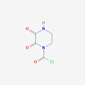 molecular formula C5H5ClN2O3 B070895 2,3-Dioxopiperazine-1-carbonyl chloride CAS No. 176701-73-8