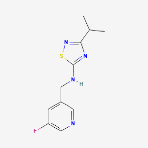 molecular formula C11H13FN4S B7116231 N-[(5-fluoropyridin-3-yl)methyl]-3-propan-2-yl-1,2,4-thiadiazol-5-amine 