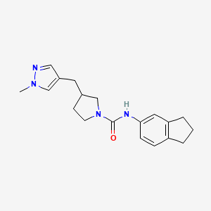 molecular formula C19H24N4O B7133644 N-(2,3-dihydro-1H-inden-5-yl)-3-[(1-methylpyrazol-4-yl)methyl]pyrrolidine-1-carboxamide 