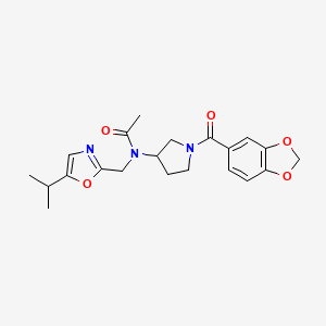 molecular formula C21H25N3O5 B7146778 N-[1-(1,3-benzodioxole-5-carbonyl)pyrrolidin-3-yl]-N-[(5-propan-2-yl-1,3-oxazol-2-yl)methyl]acetamide 