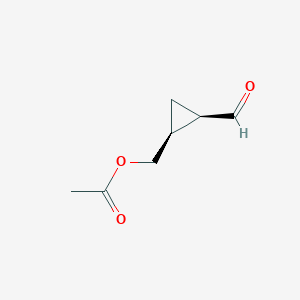 molecular formula C7H10O3 B071515 Cyclopropanecarboxaldehyde, 2-[(acetyloxy)methyl]-, (1R,2S)-(9CI) CAS No. 166762-22-7