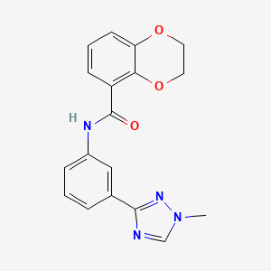 molecular formula C18H16N4O3 B7167209 N-[3-(1-methyl-1,2,4-triazol-3-yl)phenyl]-2,3-dihydro-1,4-benzodioxine-5-carboxamide 
