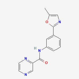 molecular formula C15H12N4O2 B7173382 N-[3-(5-methyl-1,3-oxazol-2-yl)phenyl]pyrazine-2-carboxamide 