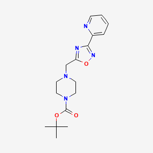 molecular formula C17H23N5O3 B7178057 Tert-butyl 4-[(3-pyridin-2-yl-1,2,4-oxadiazol-5-yl)methyl]piperazine-1-carboxylate 