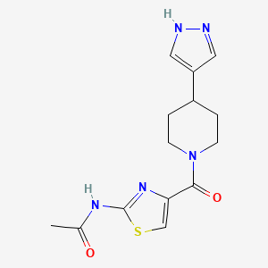 molecular formula C14H17N5O2S B7180446 N-[4-[4-(1H-pyrazol-4-yl)piperidine-1-carbonyl]-1,3-thiazol-2-yl]acetamide 