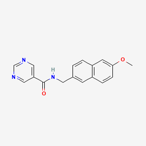 molecular formula C17H15N3O2 B7194538 N-[(6-methoxynaphthalen-2-yl)methyl]pyrimidine-5-carboxamide 