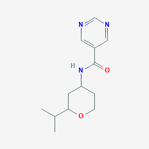 molecular formula C13H19N3O2 B7194653 N-(2-propan-2-yloxan-4-yl)pyrimidine-5-carboxamide 