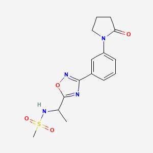 molecular formula C15H18N4O4S B7195231 N-[1-[3-[3-(2-oxopyrrolidin-1-yl)phenyl]-1,2,4-oxadiazol-5-yl]ethyl]methanesulfonamide 