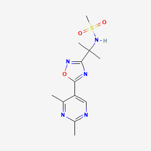 molecular formula C12H17N5O3S B7195843 N-[2-[5-(2,4-dimethylpyrimidin-5-yl)-1,2,4-oxadiazol-3-yl]propan-2-yl]methanesulfonamide 