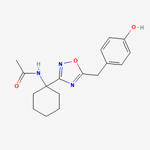 molecular formula C17H21N3O3 B7200976 N-[1-[5-[(4-hydroxyphenyl)methyl]-1,2,4-oxadiazol-3-yl]cyclohexyl]acetamide 
