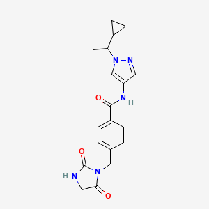 molecular formula C19H21N5O3 B7202020 N-[1-(1-cyclopropylethyl)pyrazol-4-yl]-4-[(2,5-dioxoimidazolidin-1-yl)methyl]benzamide 