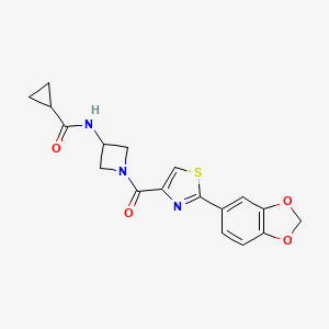 molecular formula C18H17N3O4S B7202032 N-[1-[2-(1,3-benzodioxol-5-yl)-1,3-thiazole-4-carbonyl]azetidin-3-yl]cyclopropanecarboxamide 