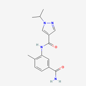 molecular formula C15H18N4O2 B7206114 N-(5-carbamoyl-2-methylphenyl)-1-propan-2-ylpyrazole-4-carboxamide 
