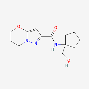 molecular formula C13H19N3O3 B7210182 N-[1-(hydroxymethyl)cyclopentyl]-6,7-dihydro-5H-pyrazolo[5,1-b][1,3]oxazine-2-carboxamide 