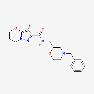 molecular formula C20H26N4O3 B7235823 N-[(4-benzylmorpholin-2-yl)methyl]-3-methyl-6,7-dihydro-5H-pyrazolo[5,1-b][1,3]oxazine-2-carboxamide 