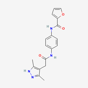molecular formula C18H18N4O3 B7243231 N-[4-[[2-(3,5-dimethyl-1H-pyrazol-4-yl)acetyl]amino]phenyl]furan-2-carboxamide 