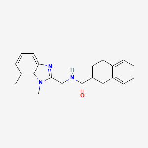 molecular formula C21H23N3O B7247833 N-[(1,7-dimethylbenzimidazol-2-yl)methyl]-1,2,3,4-tetrahydronaphthalene-2-carboxamide 