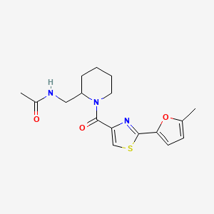 molecular formula C17H21N3O3S B7264522 N-[[1-[2-(5-methylfuran-2-yl)-1,3-thiazole-4-carbonyl]piperidin-2-yl]methyl]acetamide 