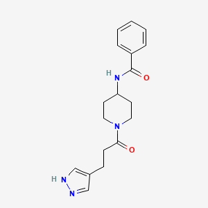 molecular formula C18H22N4O2 B7264558 N-[1-[3-(1H-pyrazol-4-yl)propanoyl]piperidin-4-yl]benzamide 