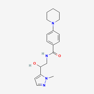 molecular formula C18H24N4O2 B7292783 N-[2-hydroxy-2-(2-methylpyrazol-3-yl)ethyl]-4-piperidin-1-ylbenzamide 