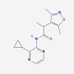 molecular formula C15H18N4O2 B7302476 N-(3-cyclopropylpyrazin-2-yl)-2-(3,5-dimethyl-1,2-oxazol-4-yl)propanamide 