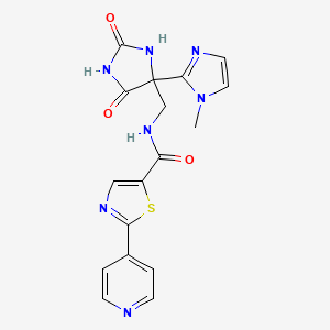 molecular formula C17H15N7O3S B7307676 N-[[4-(1-methylimidazol-2-yl)-2,5-dioxoimidazolidin-4-yl]methyl]-2-pyridin-4-yl-1,3-thiazole-5-carboxamide 