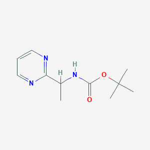 molecular formula C11H17N3O2 B7308420 tert-butyl N-(1-pyrimidin-2-ylethyl)carbamate 