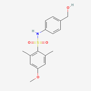 molecular formula C16H19NO4S B7311434 N-[4-(hydroxymethyl)phenyl]-4-methoxy-2,6-dimethylbenzenesulfonamide 