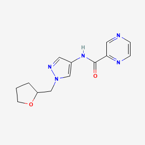 molecular formula C13H15N5O2 B7323361 N-[1-(oxolan-2-ylmethyl)pyrazol-4-yl]pyrazine-2-carboxamide 