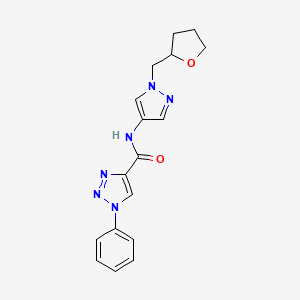 molecular formula C17H18N6O2 B7323469 N-[1-(oxolan-2-ylmethyl)pyrazol-4-yl]-1-phenyltriazole-4-carboxamide 